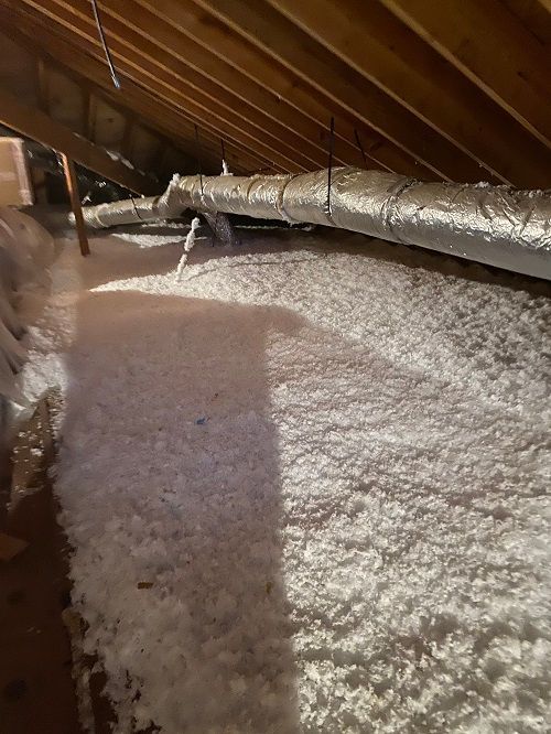 Insulation materials in the attic of a house.