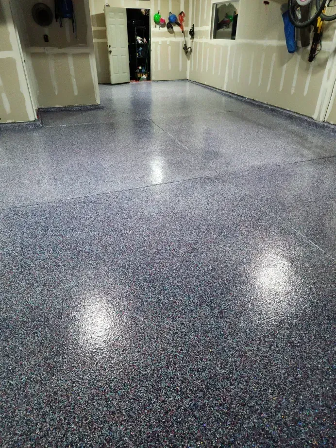 Blue speckled epoxy garage floor.