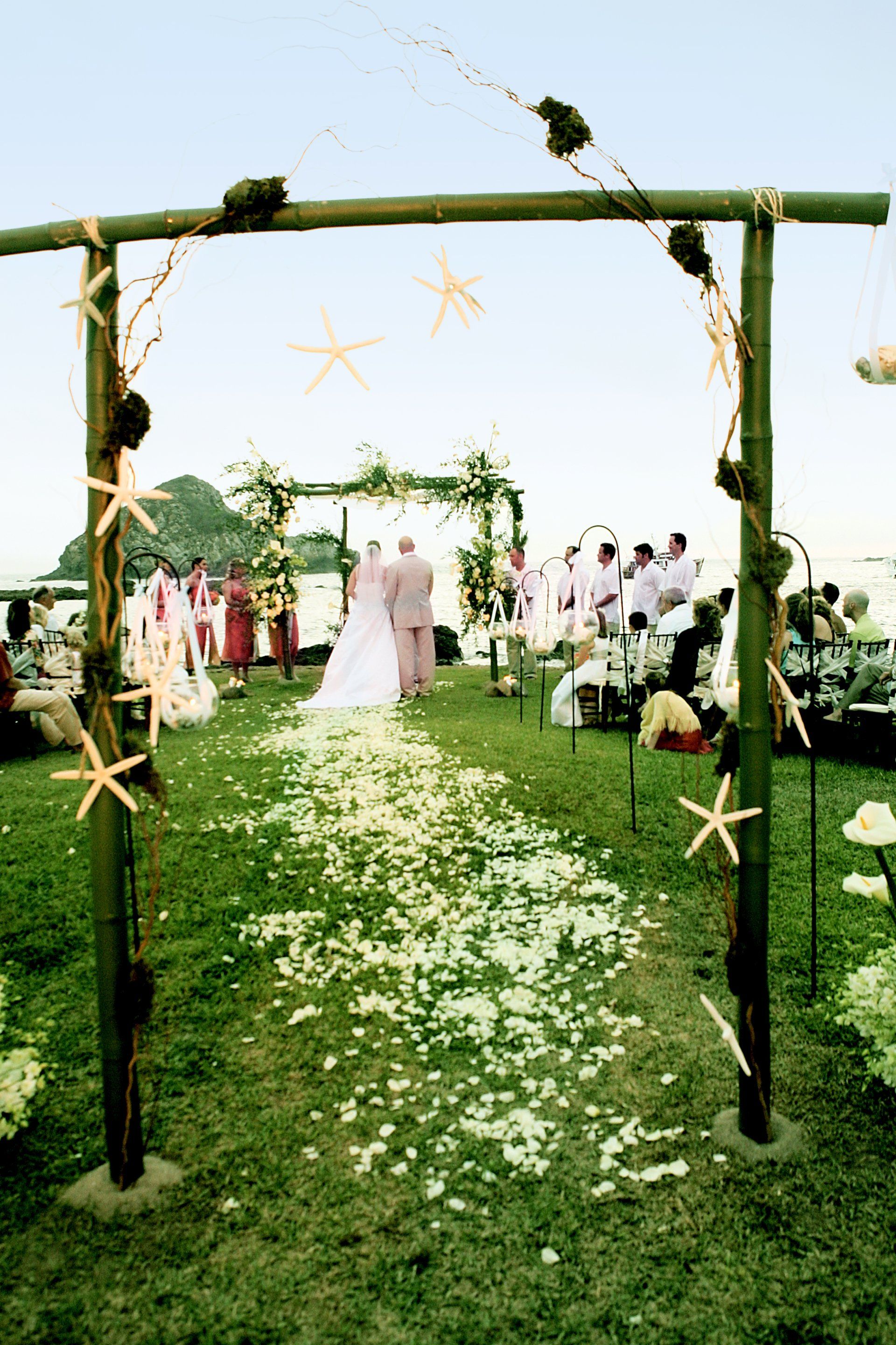A bride and groom are walking down the aisle at a wedding ceremony.