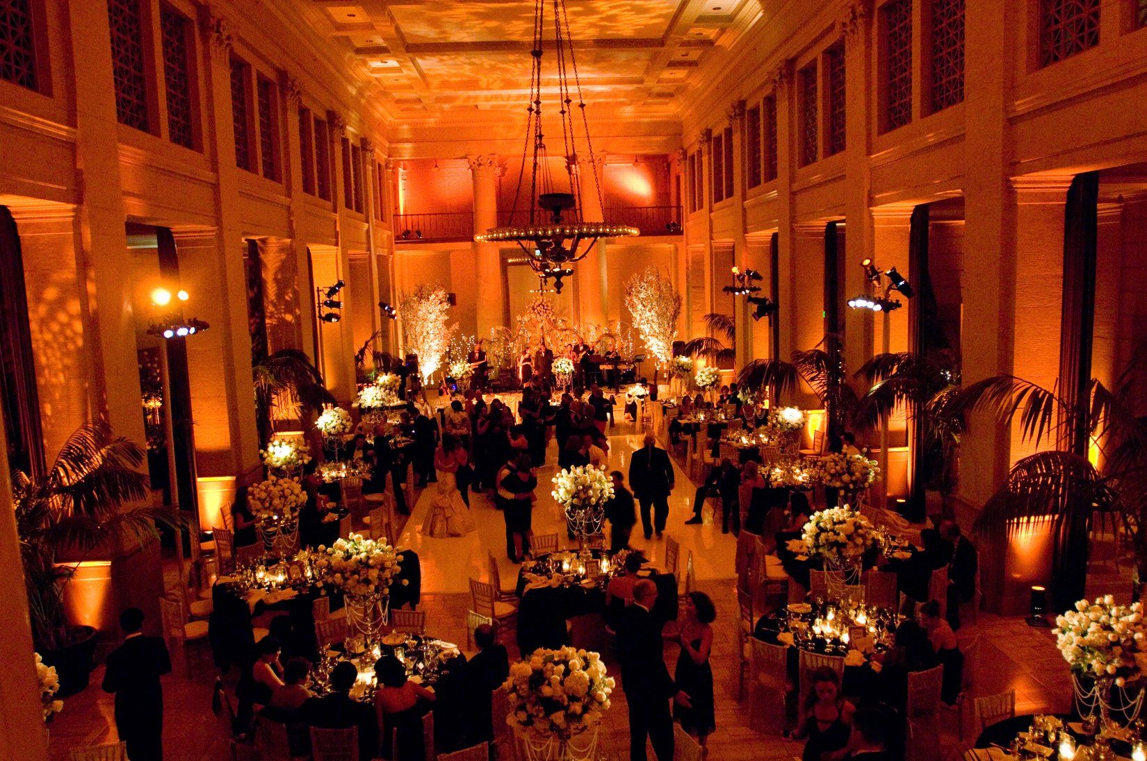 A large room with a lot of tables and people