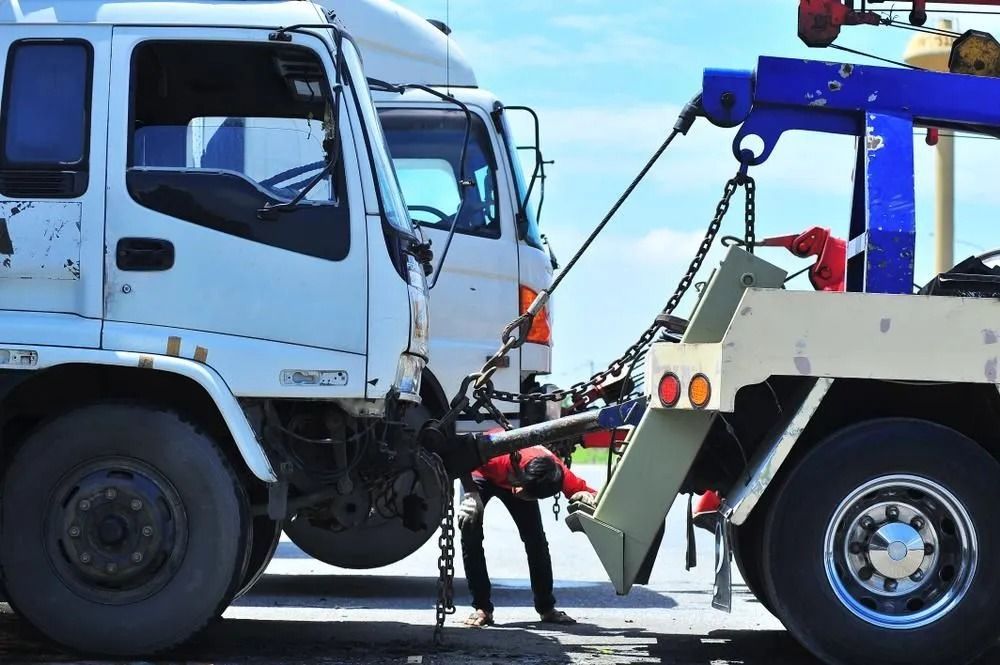 Tow Truck Towing a White Truck — Alfie's Towing in Cloncurry, QLD