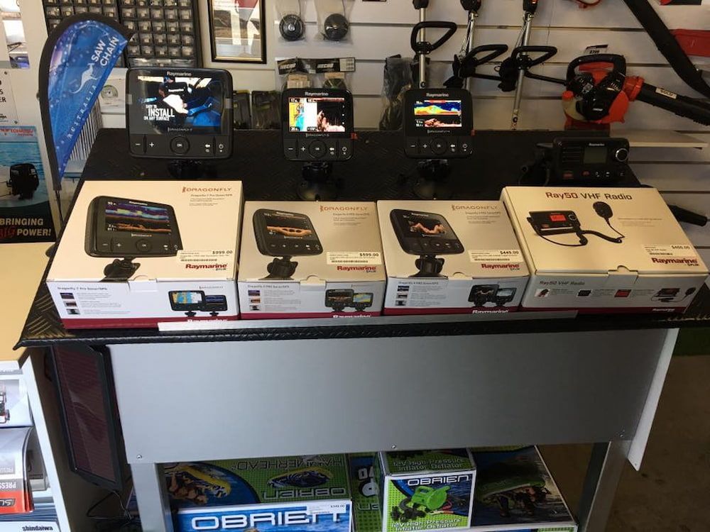 A Table With Boxes Of Fishing Equipment On It — Posties Caravans Boats Small Engines Inverell In Glen Innes, NSW