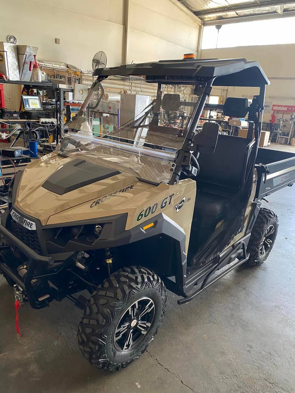 A Polaris Utility Vehicle Is Parked In A Garage — Posties Caravans Boats Small Engines Inverell In Inverell, NSW