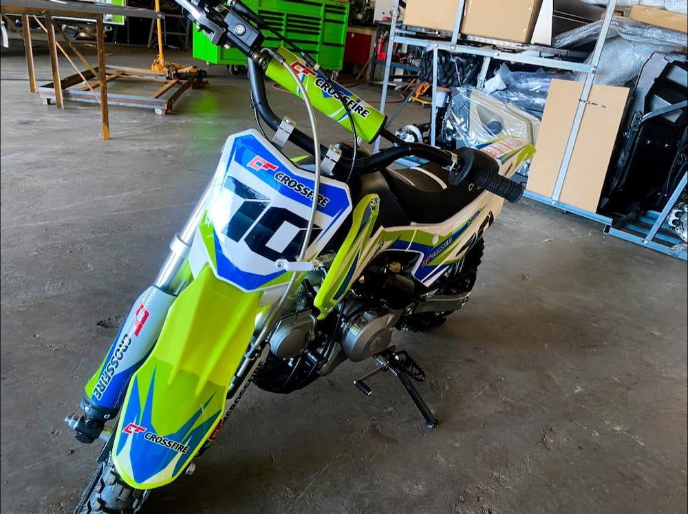 A Green And Blue Dirt Bike With The Number 10 On The Front — Posties Caravans Boats Small Engines Inverell In Armidale, NSW