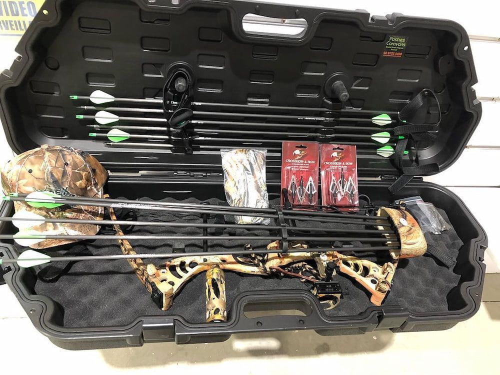 A Bow And Arrows Are In A Case On A Table — Posties Caravans Boats Small Engines Inverell In Armidale, NSW