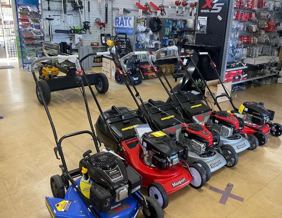 A Row Of Lawn Mowers Are Lined Up In A Store — Posties Caravans Boats Small Engines Inverell In Armidale, NSW