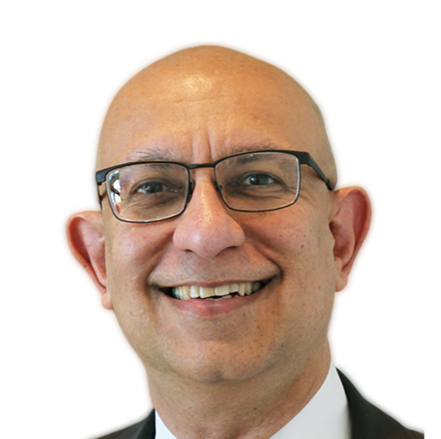 A large building with balconies and hanging potted plants