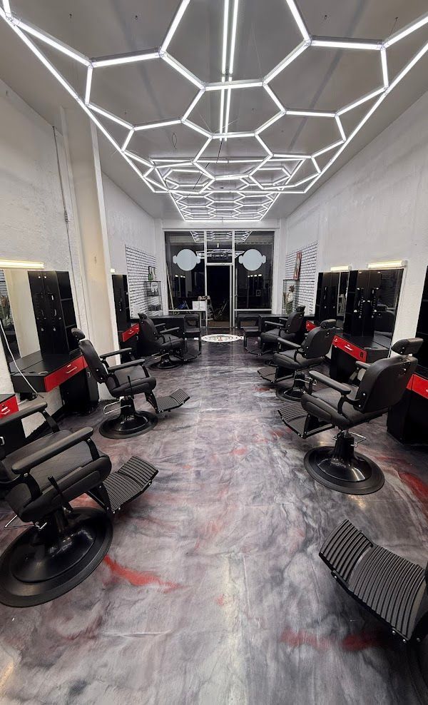 Black leather barber kit with shears, combs, and clippers.