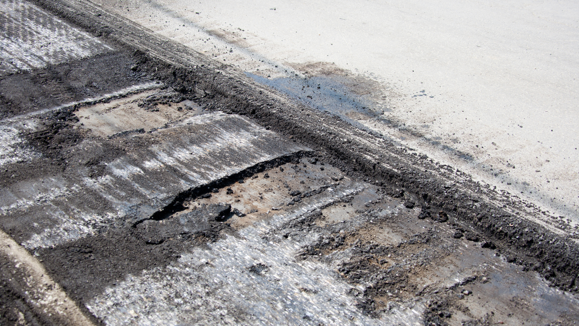 A close up of a piece of asphalt on a road.