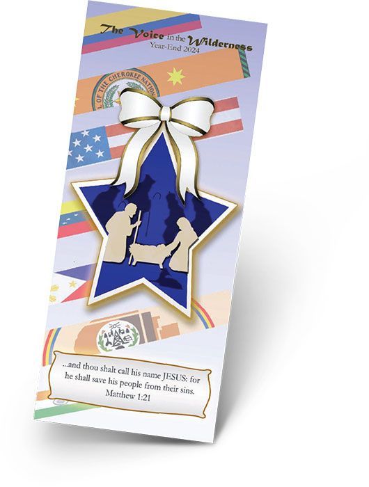 Bookmark with blue star cutout of Nativity scene, white bow, flags in background, and Bible verse.