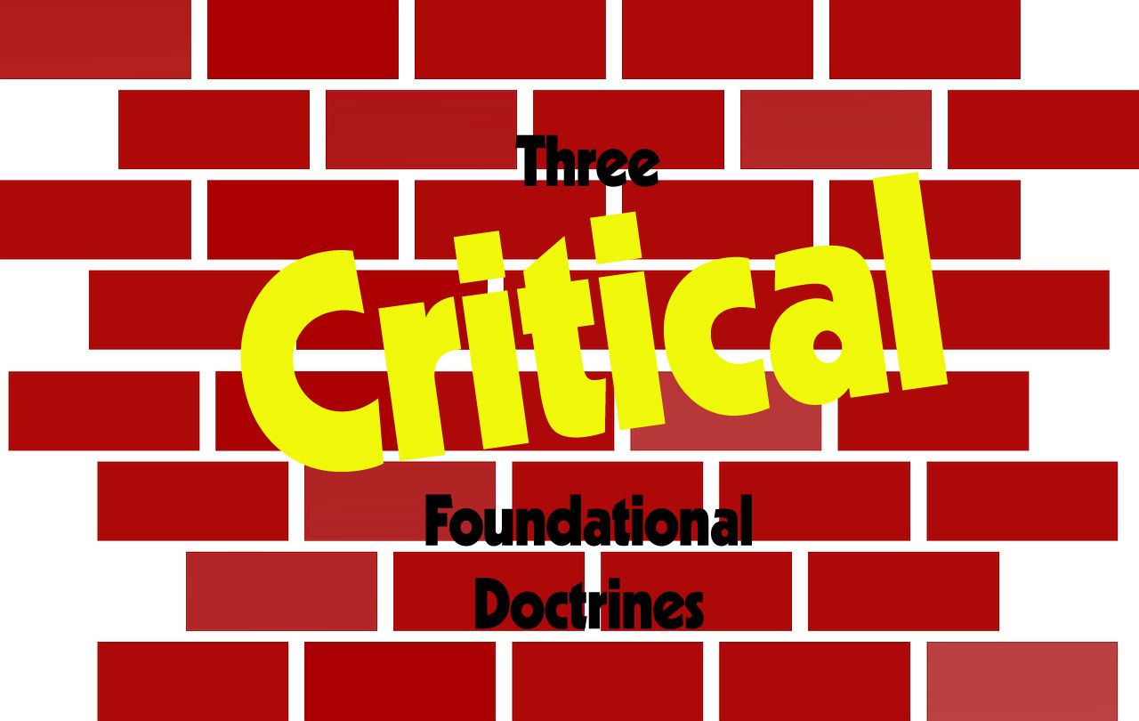 A red brick wall with the words three critical foundational doctrines written on it