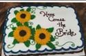 A wedding cake with sunflowers on it and the words `` happy coming the bride ''.