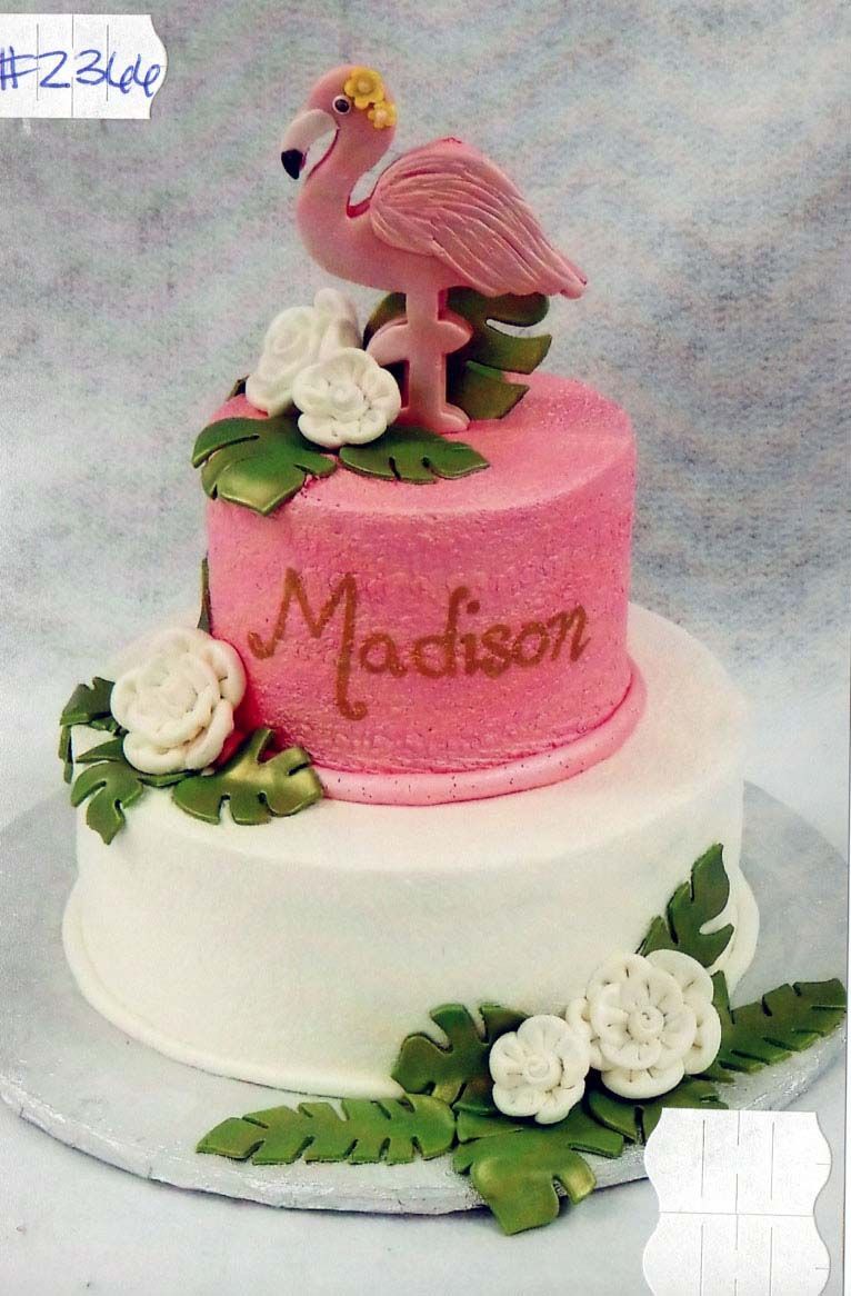 A pink and white cake with the name madison on it