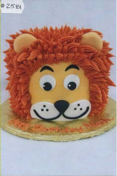 A cake that looks like a lion with the number 25 on it