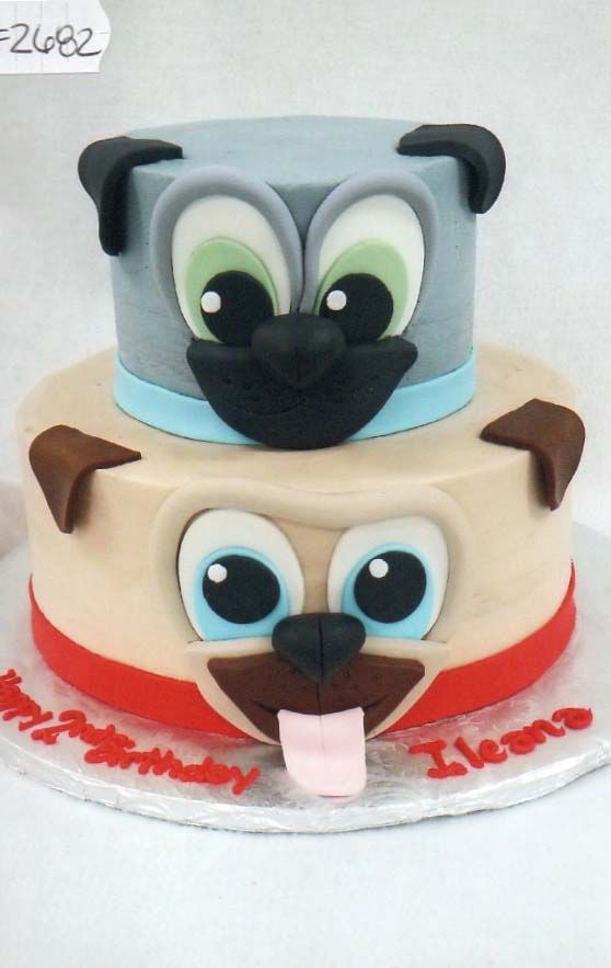 A birthday cake with a dog face on it