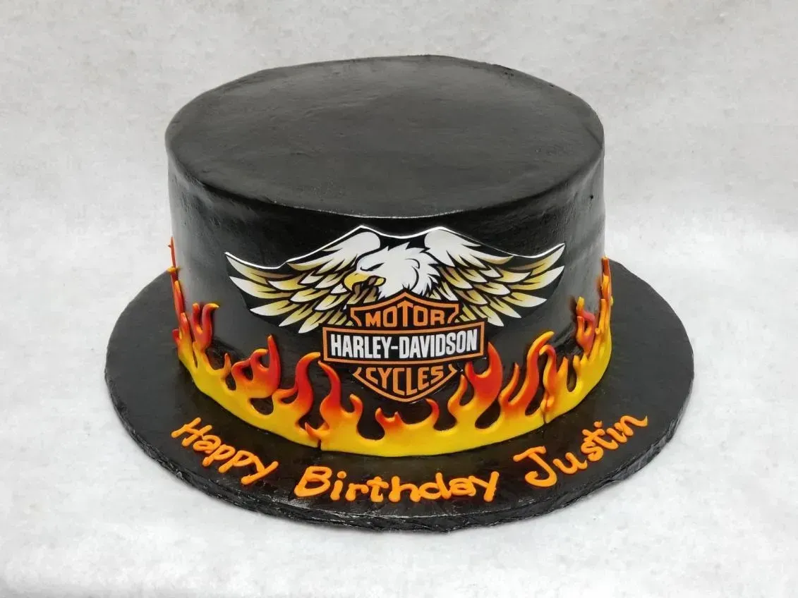 A birthday cake with a harley davidson logo on it