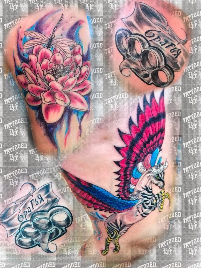 A close up of a person 's chest with a lot of tattoos on it.