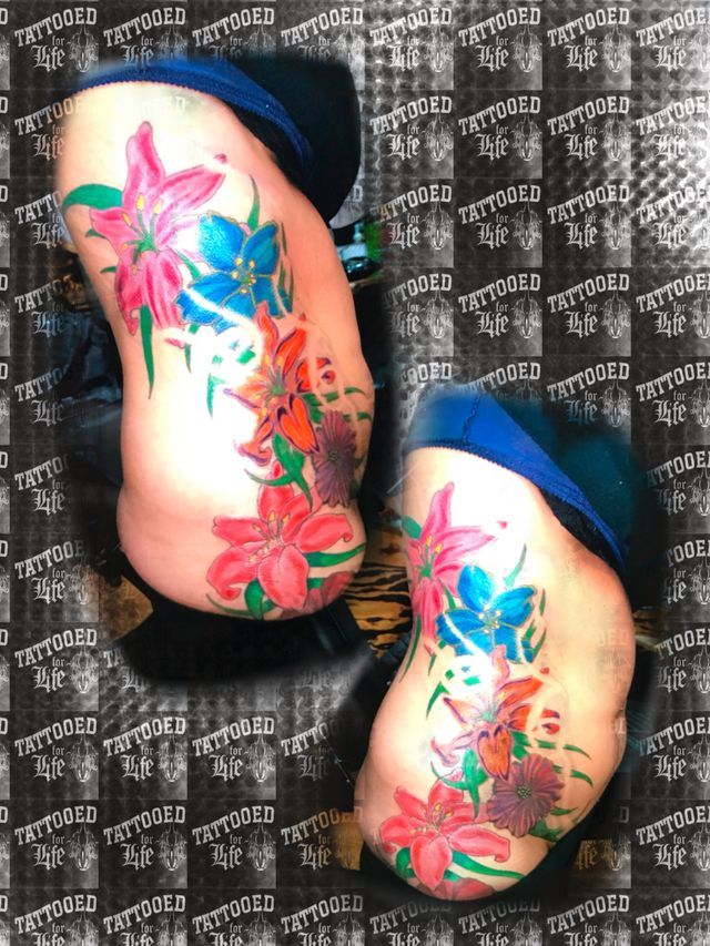 A person with a tattoo of flowers on their feet