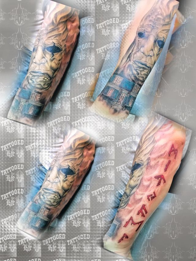 A tattoo on a person 's arm with chinese writing on it