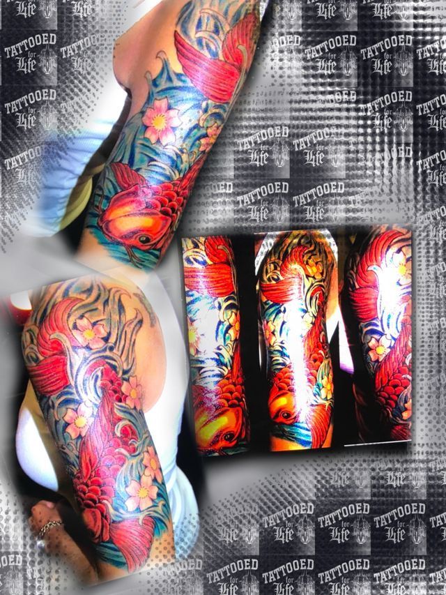 A man has a full sleeve tattoo on his arm