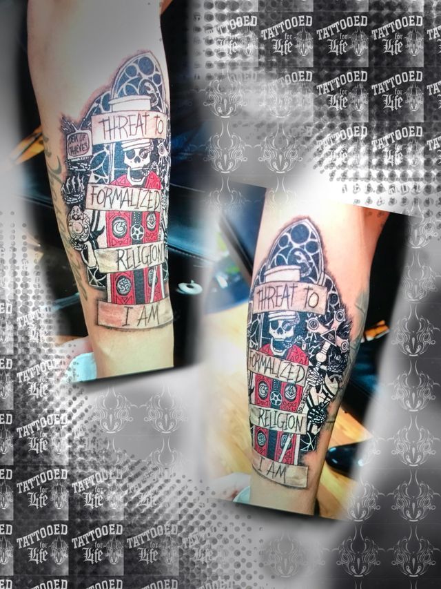 A person has a tattoo on their leg with a skull and a skeleton on it.