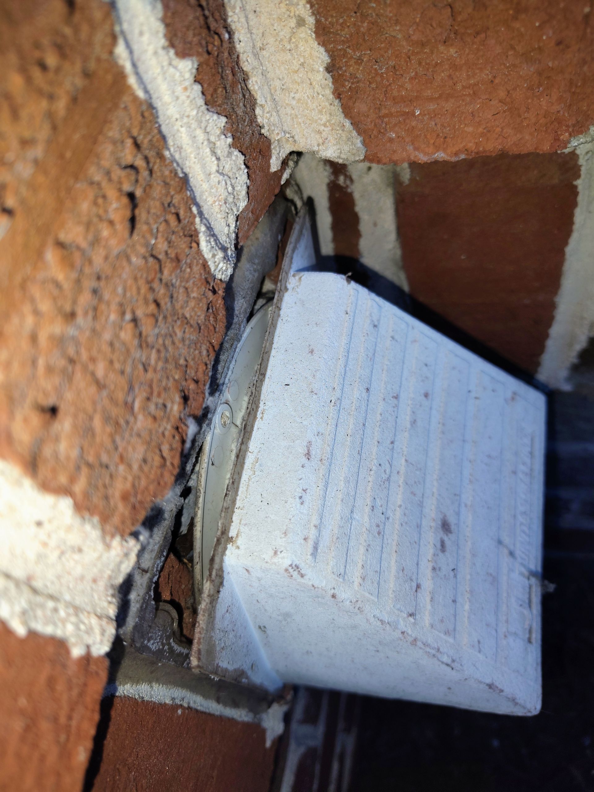 Close-up of tools: pliers, screwdrivers, and other hardware on a rusty metal surface.