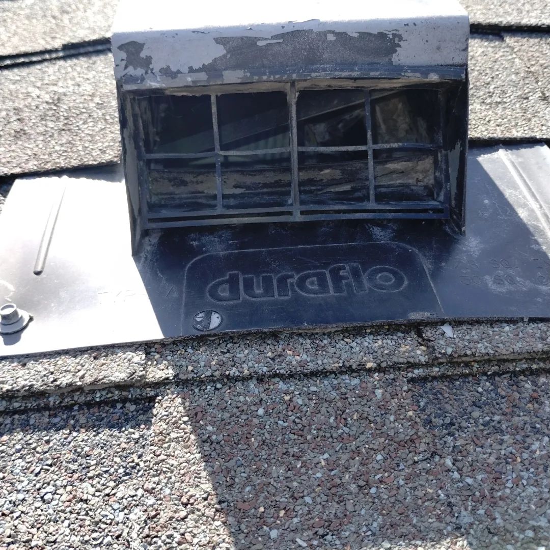 Laundry room with washing machines, a trash can, and a clock.