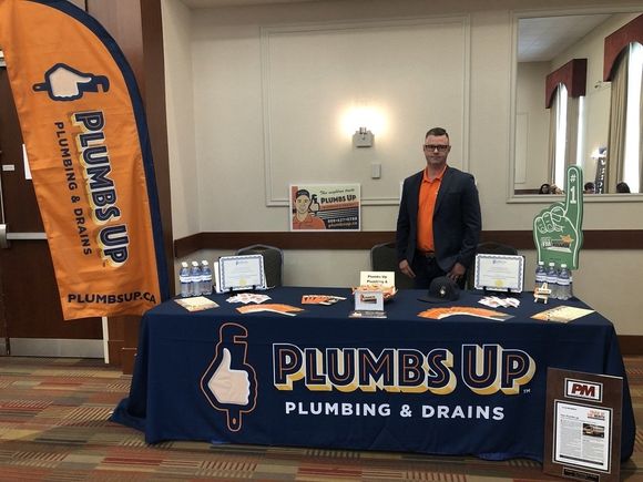 Owner of Plumbs Up Plumbing & Drains at Trade Show
