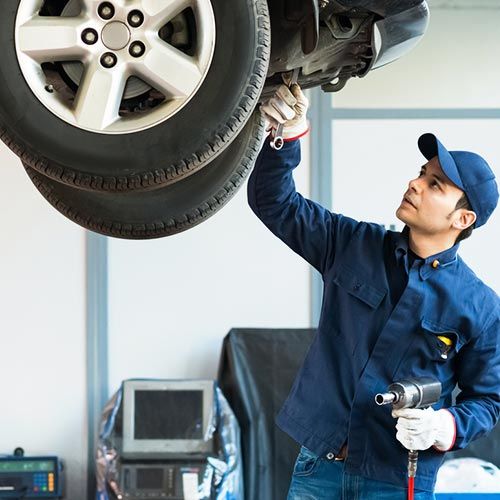 Auto Repair Service — Mechanic at Work in His Garage in Santa Cruz, CA
