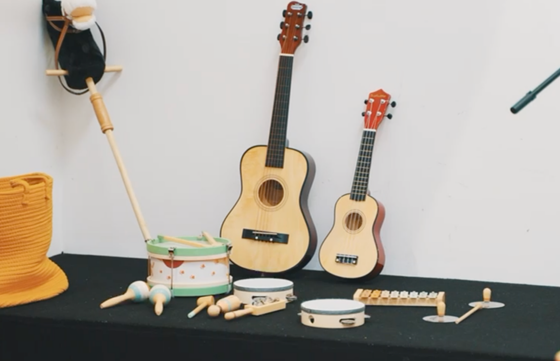 A table with a bunch of musical instruments on it
