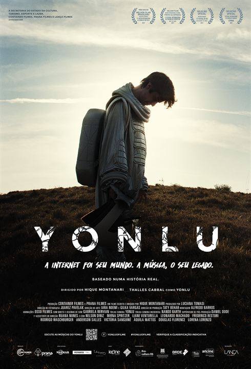 Um pôster do filme para yonlu com um homem segurando um violão