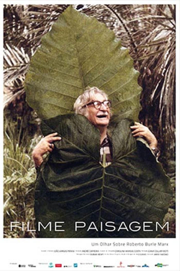 Cartaz do filme paisagem mostra um homem segurando uma grande folha verde