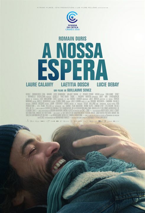 A movie poster for a nossa espera shows a man holding a baby