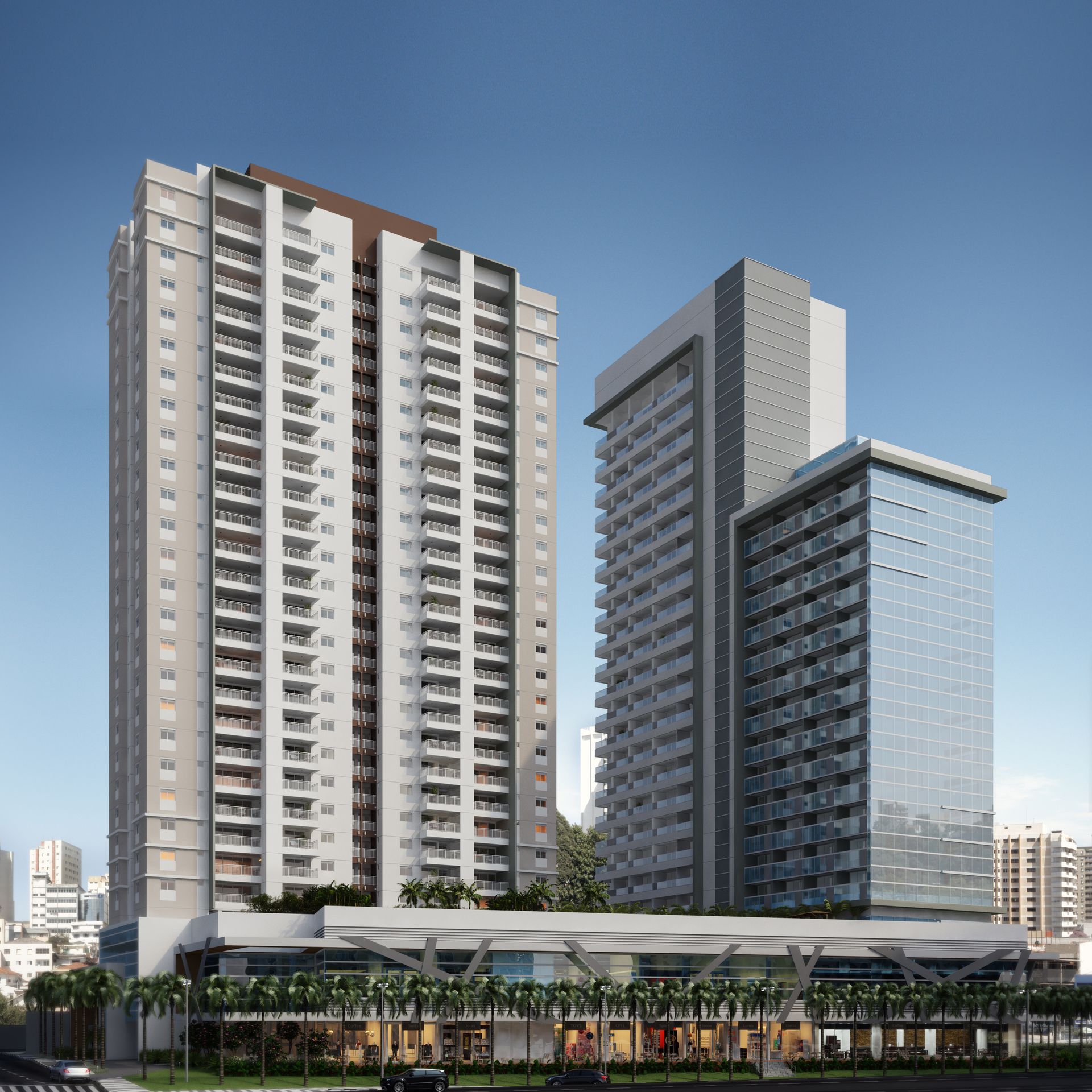 Um grande edifício com muitas janelas é cercado por árvores.