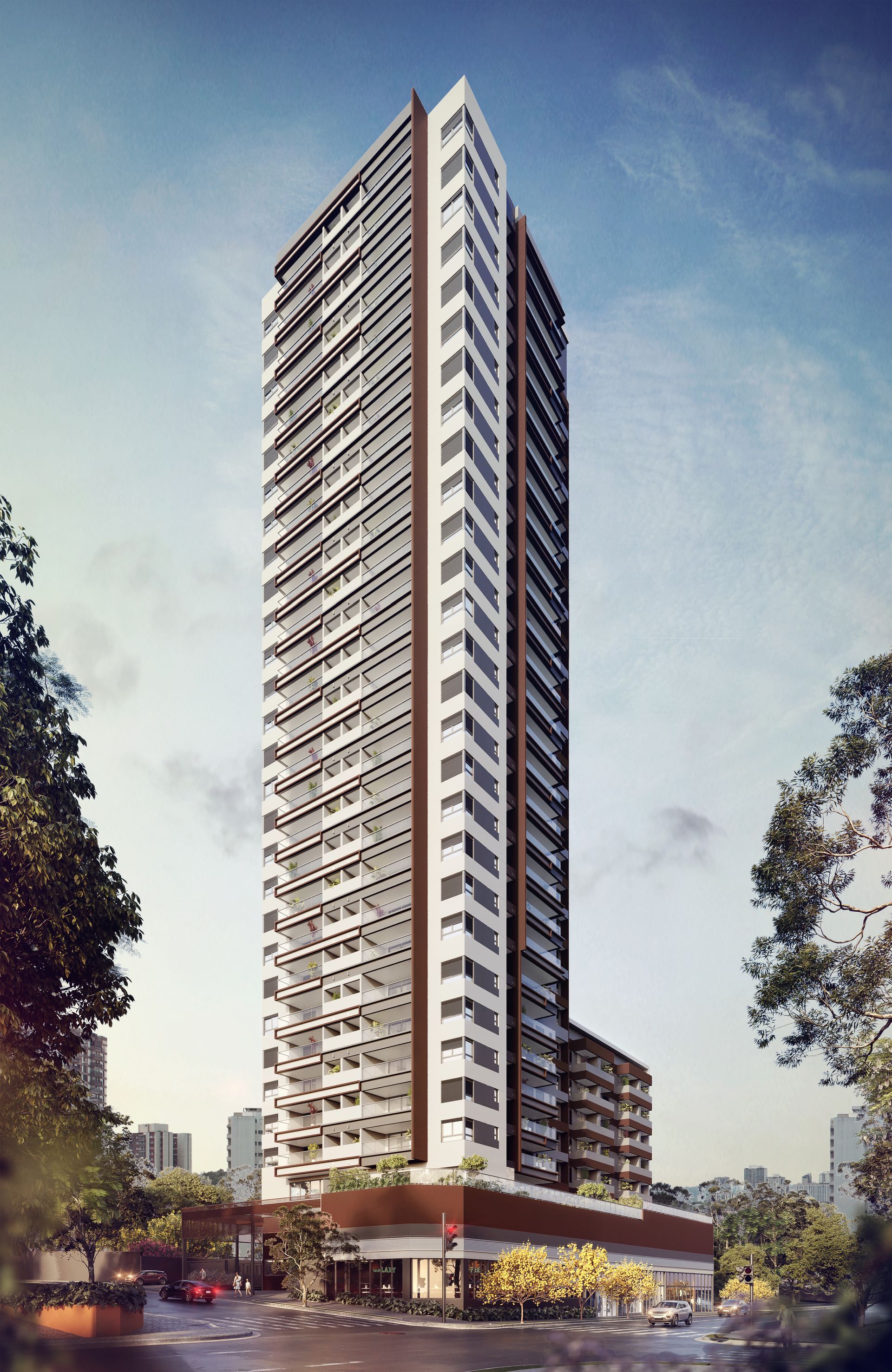 Um grande edifício com muitas janelas é cercado por árvores.