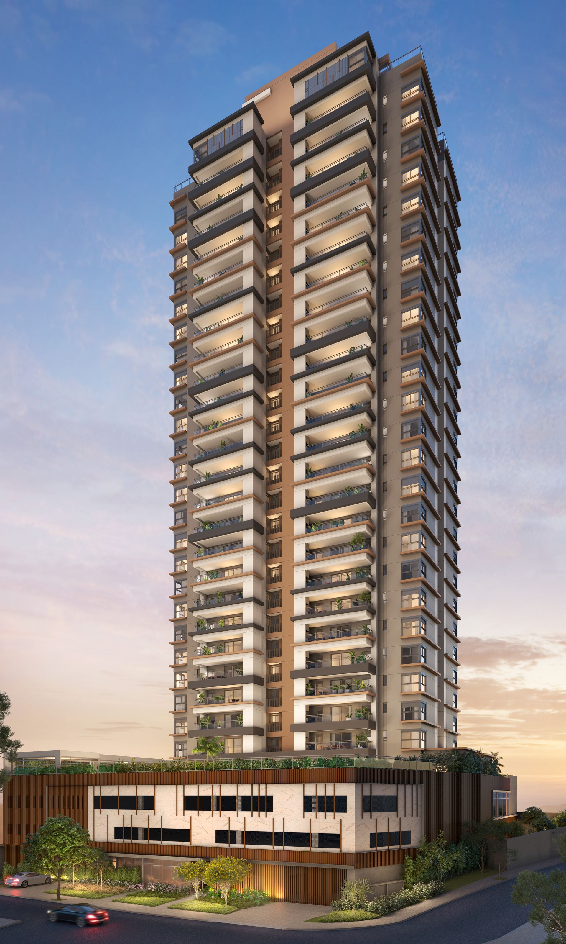 Um grande edifício com muitas janelas é cercado por árvores.