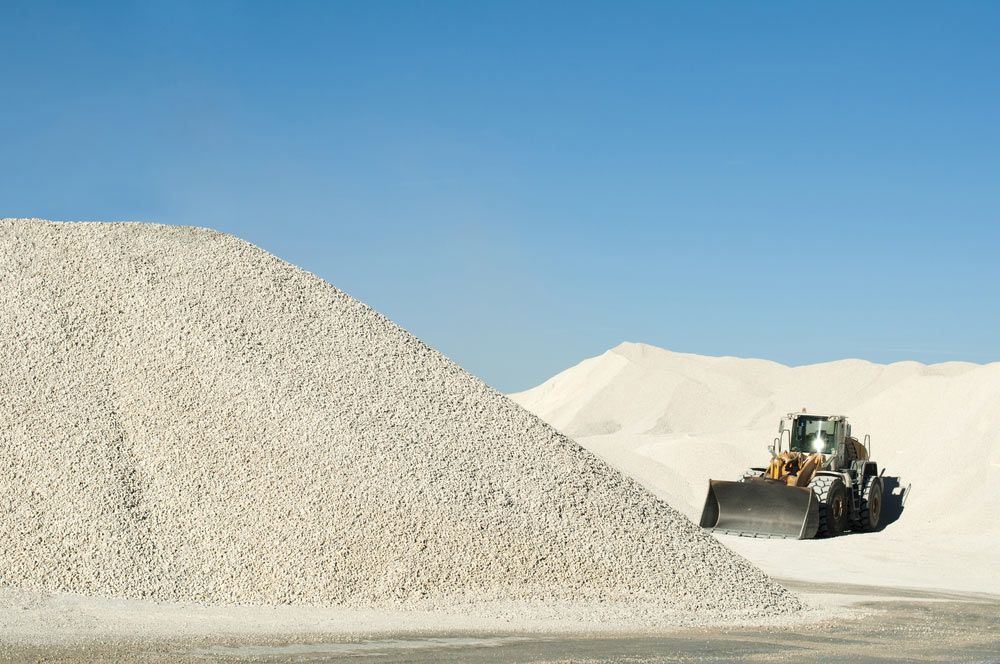 A Bulldozer Is Moving A Large Pile Of Gravel — Zappala Raw Materials Pty Ltd In Edmonton, QLD
