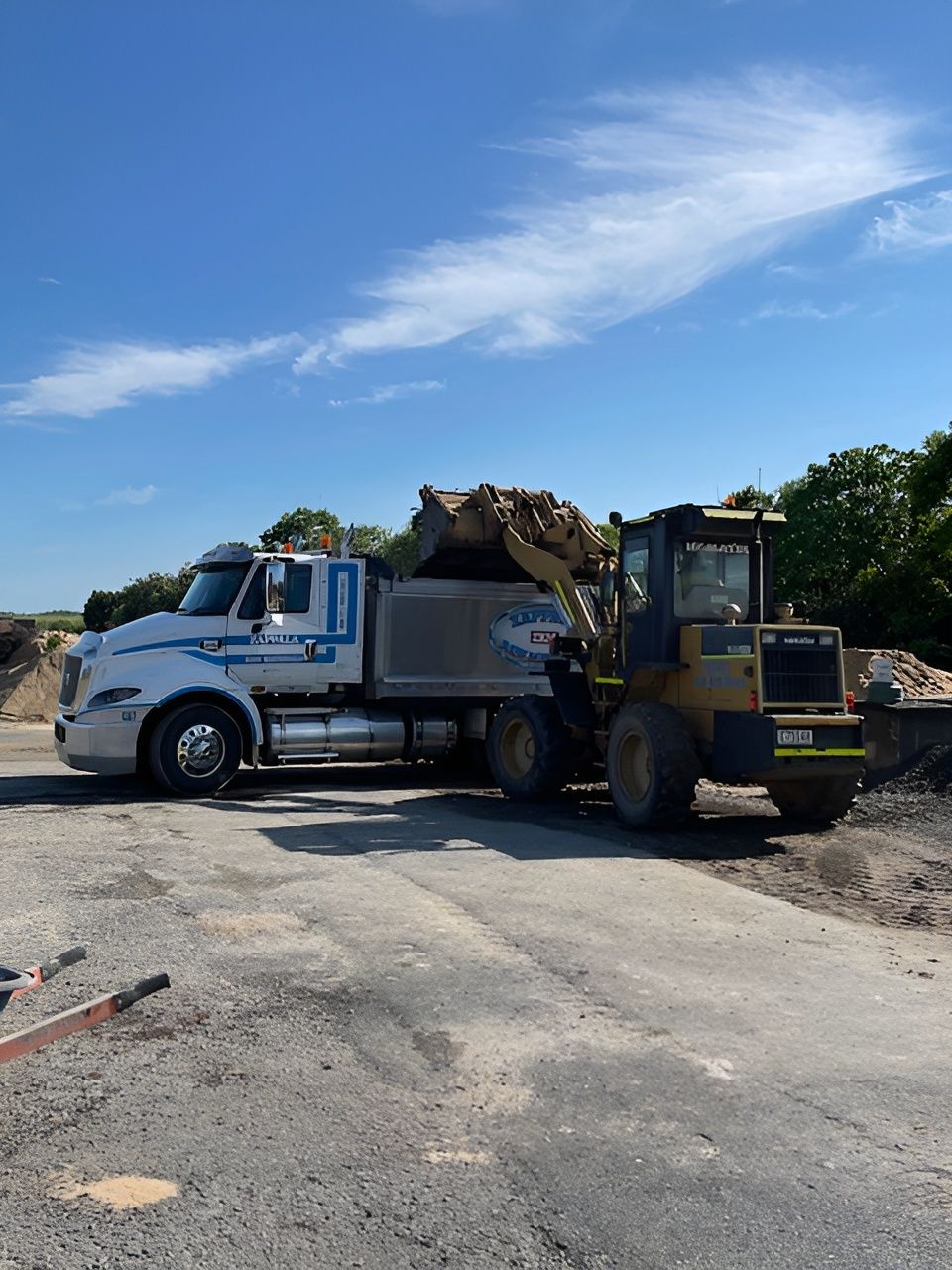 A Dump Truck Is Dumping Dirt Into A Pile — Zappala Raw Materials Pty Ltd In Edmonton, QLD