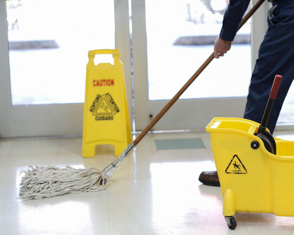 Worker Mopping Floor Office — Danbury, CT — J & P Cleaning Service
