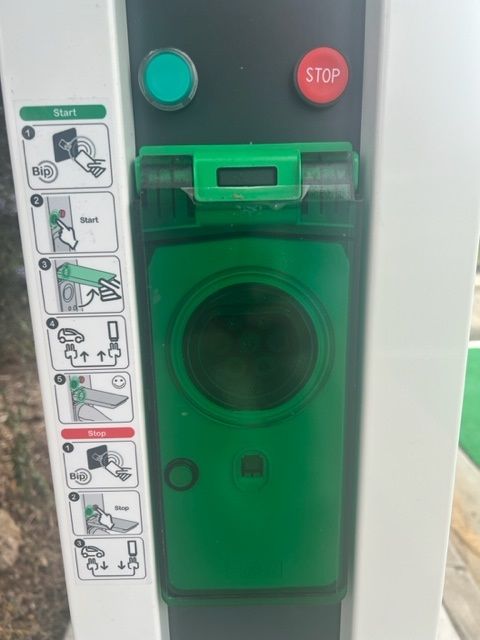 a close up of a charging station with instructions on how to use it .