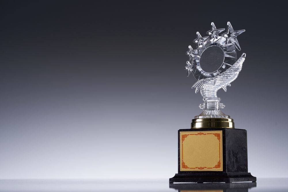 A Trophy with A Circle on Top of It Is Sitting on A Table — Jimani Trophies & Engraving In Dapto, NSW