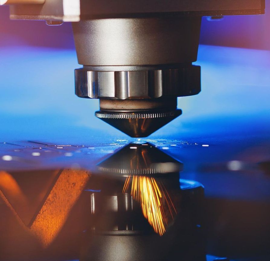 A Close Up of a Machine Cutting a Piece of Metal — Jimani Trophies & Engraving In Dapto, NSW