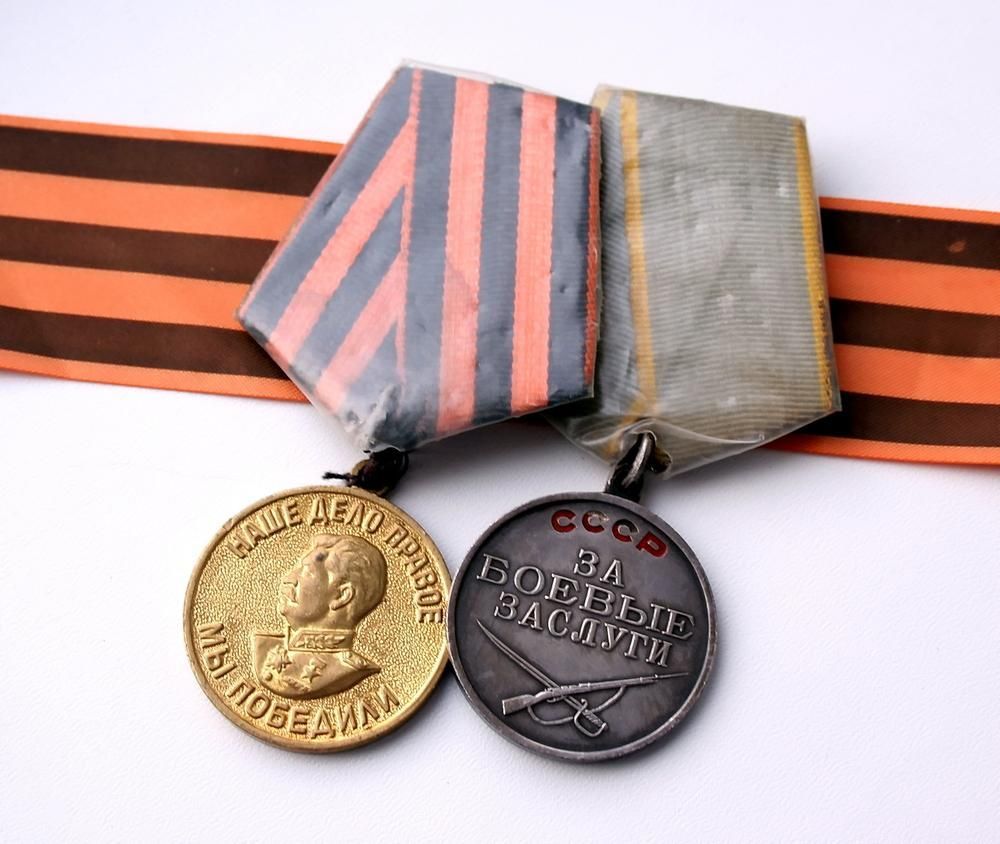 Two Medals with One that Says Cccp on It — Jimani Trophies & Engraving in Dapto, NSW
