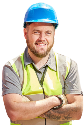 A man wearing a hard hat and safety vest is standing with his arms crossed.