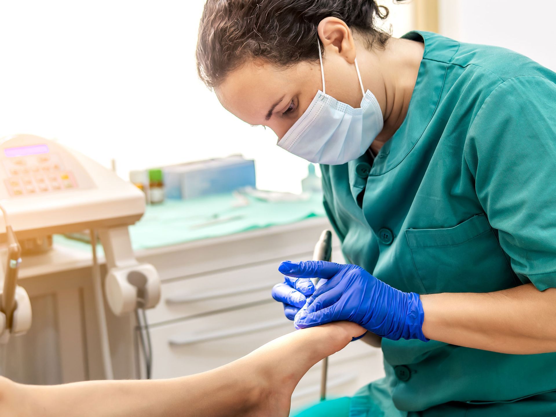 Female podiatrist doing chiropody in Portland, OR, service provided by Advanced Foot Clinic