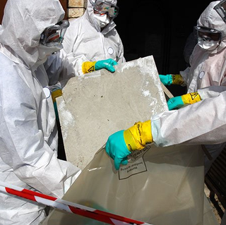 Men in Suit Safely Removing Asbestos — Cypress, CA — Golden State Environmental