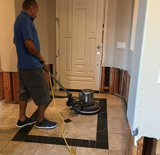 A Man Vacuuming the Floor — Cypress, CA — Golden State Environmental