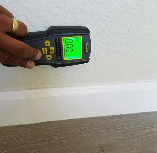 Moisture Tester Using on a Wall — Cypress, CA — Golden State Environmental