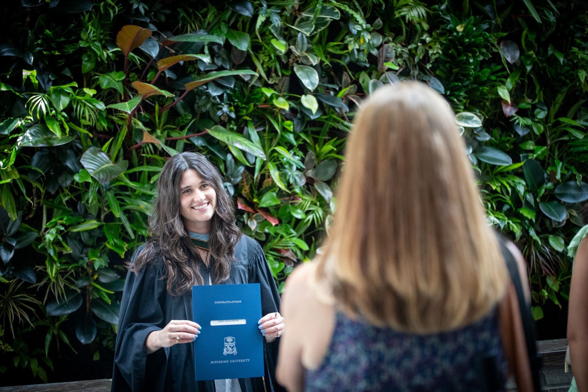 Nipissing University graduate posing for a picture