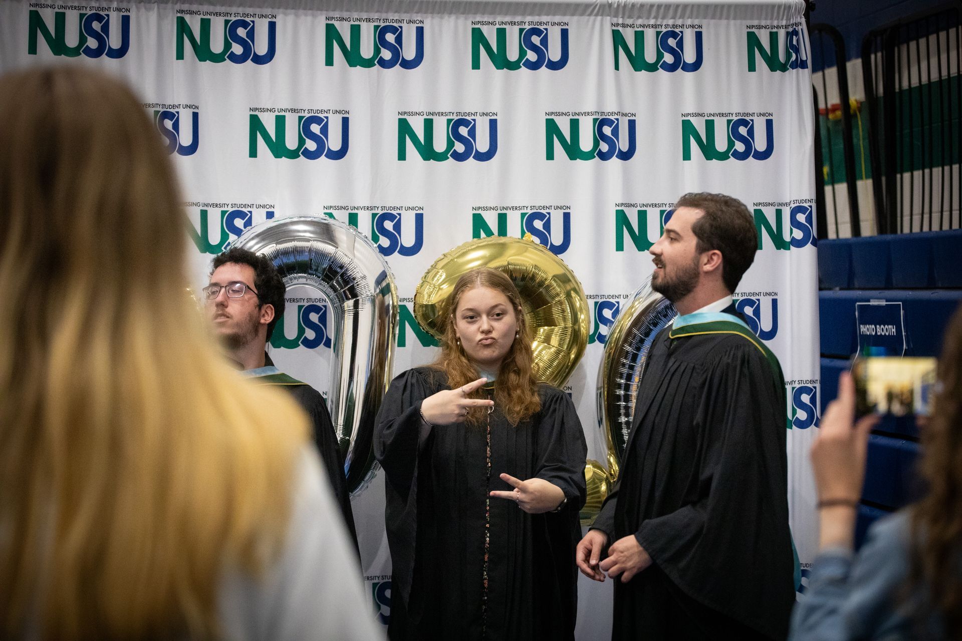 Nipissing University graduate posing for a picture